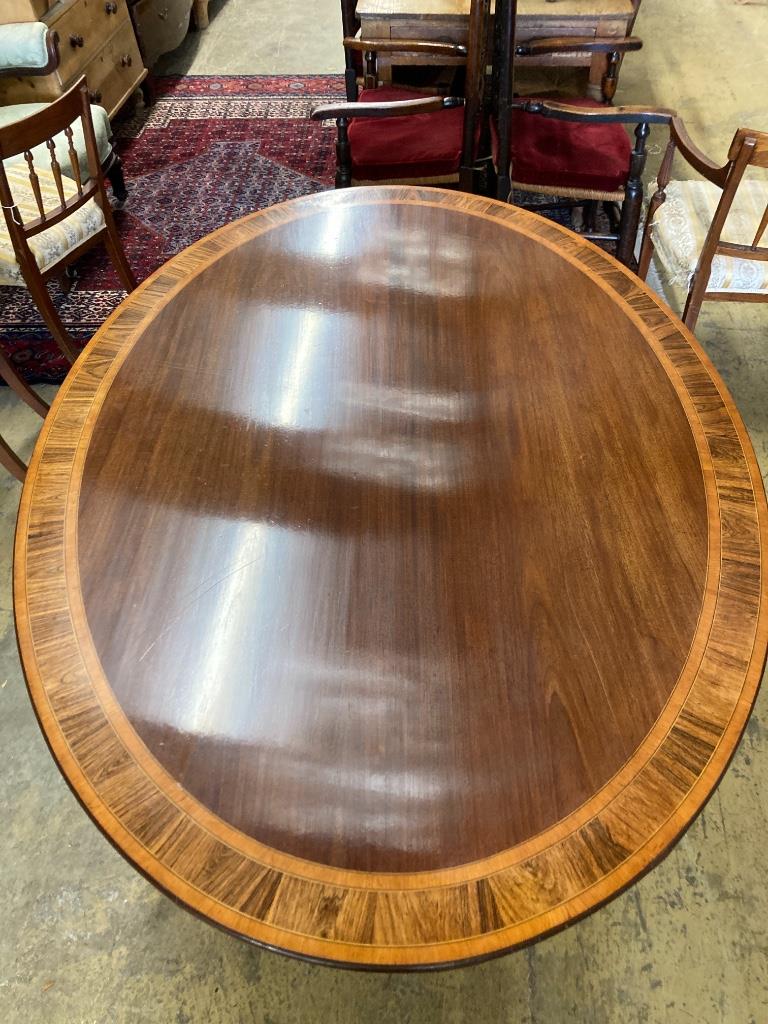 A George III style rosewood banded mahogany oval breakfast table, length 170cm, width 120cm, height 73cm